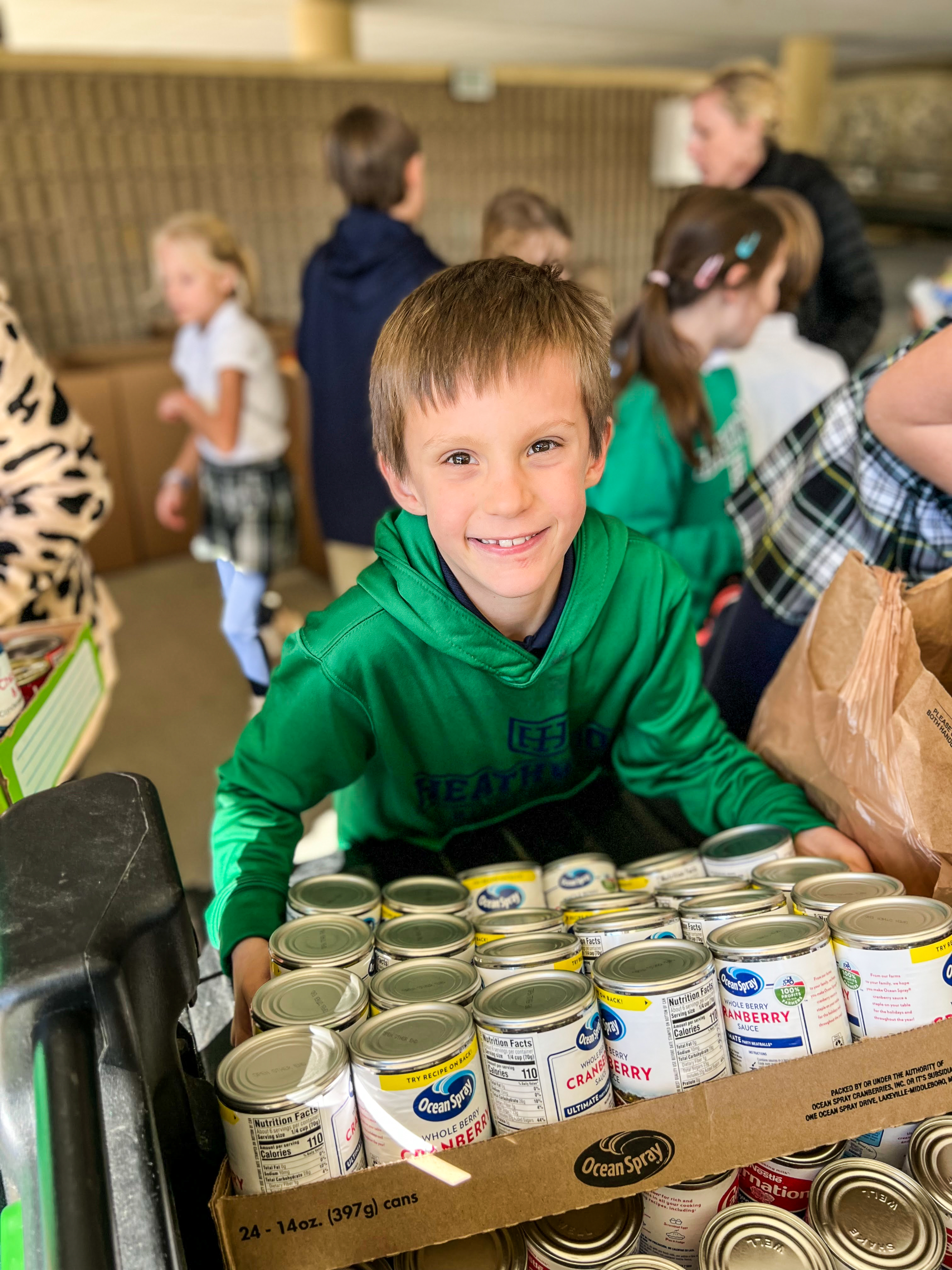 Heathwood student collecting food for Harvest Hope